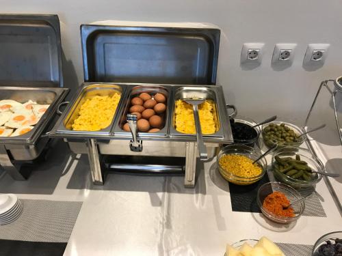 a buffet with different types of food on a table at Hotel Grad in Sarajevo