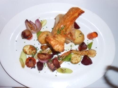 a white plate of food with meat and vegetables at Dinorben Arms Hotel in Amlwch