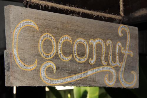 a sign that says oxfam hanging from a chain at Fruit Tree Lodge in Ko Lanta