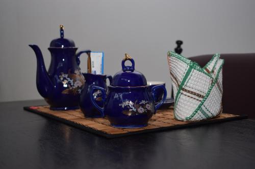 a group of vases and a basket on a table at City Paradise Dambulla in Dambulla
