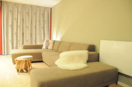 a living room with a couch and a chair at Haus Nohra in Sankt Michael im Lungau