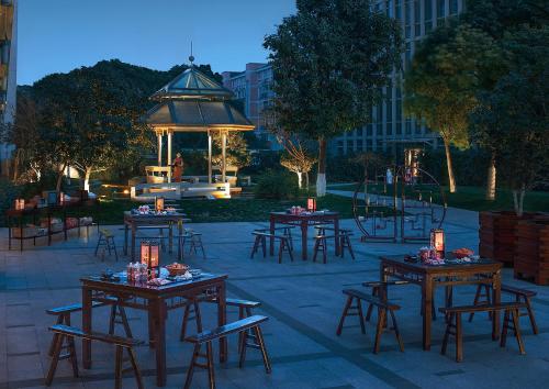 a group of tables and chairs with a gazebo at Shangri-La Suzhou in Suzhou