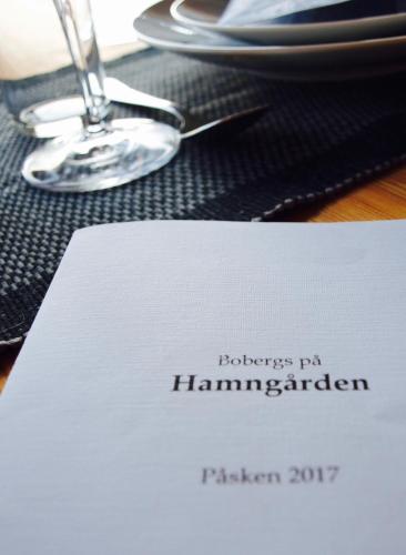 a white napkin sitting on top of a table at Bobergs på Hamngården in Brantevik
