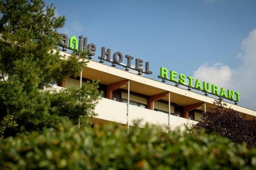 a hotel sign on top of a building at Campanile Hotel & Restaurant Rotterdam Oost in Rotterdam