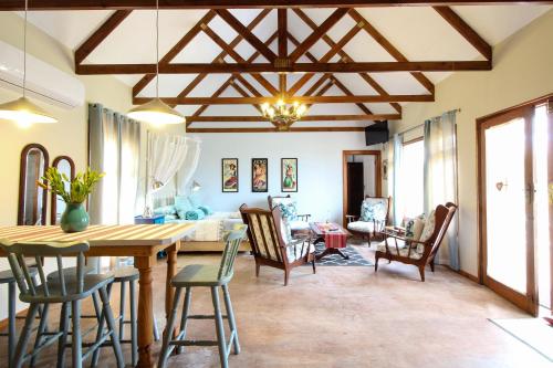 a dining room with a table and chairs at Lentelus Guesthouse in George