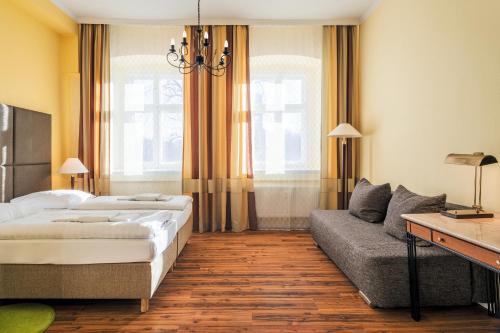 Postel nebo postele na pokoji v ubytování Hotel-Pension Michele