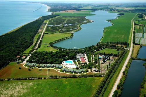an aerial view of a large island in a body of water at Club Village & Hotel Spiaggia Romea in Lido di Volano