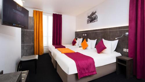 Letto o letti in una camera di Hôtel du Plat d'Etain