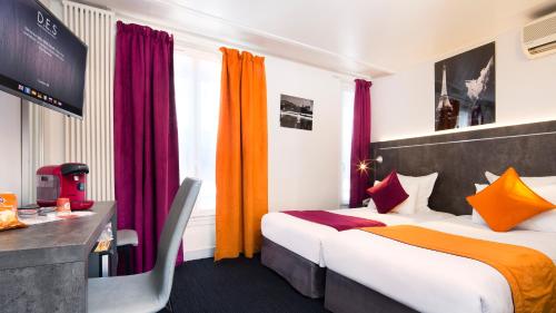 Letto o letti in una camera di Hôtel du Plat d'Etain