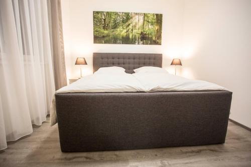 Letto o letti in una camera di Spreehaus-Apartments
