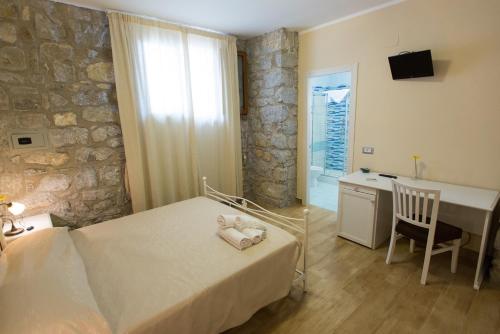 Postel nebo postele na pokoji v ubytování B&B Incanto del Mare