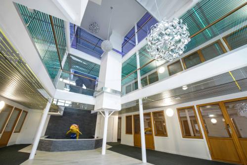 a lobby of a building with a chandelier at Zinn Apartments - City Centre in Aberdeen