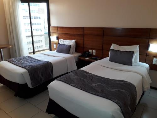 Кровать или кровати в номере Hotel Princesa Louçã