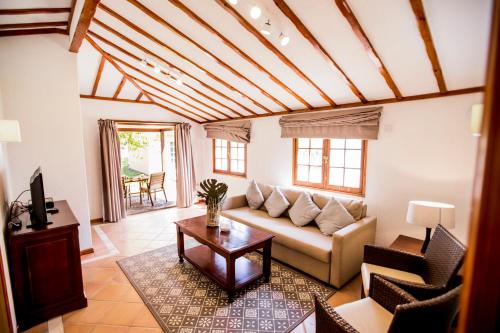 a living room with a couch and a table at Bahía de Ávalos in San Sebastián de la Gomera