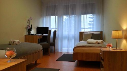 Ένα ή περισσότερα κρεβάτια σε δωμάτιο στο Hostel Fortis