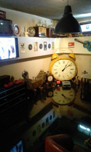 a clock hanging on a wall in a room at Lena Central Flats in Bursa
