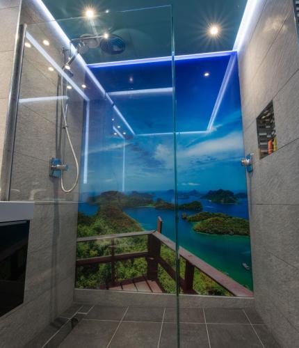 a shower stall with a view of a river at Zinn Apartments - City Centre in Aberdeen