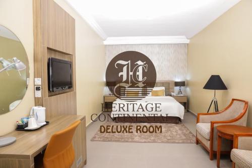 a hotel room with a bed and a welcome sign at Heritage Continental Hotel in Akure
