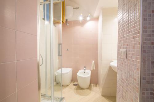 a bathroom with a shower and a toilet and a sink at Villa Mariagiovanna - Casa Giovanna in Vico Equense