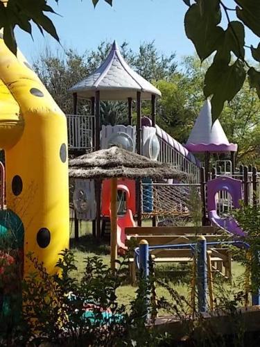 a playground with a gazebo in a park at Domaine De La Bégude in Fayence