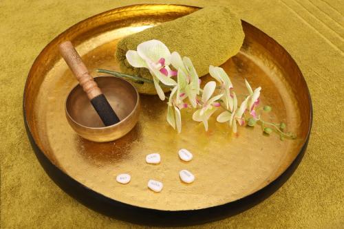 a plate of food with a spoon and pills at Nägler´s Fine Lounge Hotel in Oestrich-Winkel