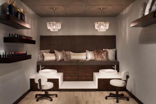 a living room with a couch and two chairs at Firebrand Hotel in Whitefish