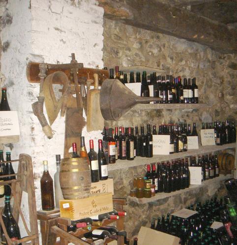 a room with a bunch of wine bottles on a wall at B&B Il Torchio in Calco
