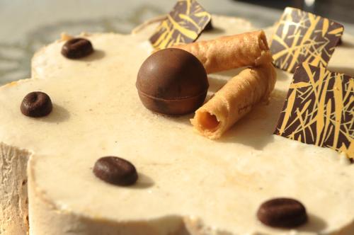 a cake with a chocolate ball on top of it at Albergo Ester in Piandimeleto