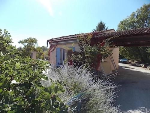 a house with a bunch of plants in front of it at Domaine De La Bégude in Fayence