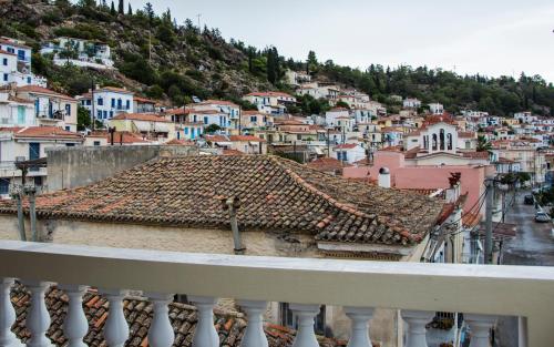 a view of a city from a balcony at Poros endless view apartment in Poros