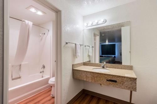 a bathroom with a sink and a toilet and a mirror at Motel 6-Astoria, OR in Astoria, Oregon