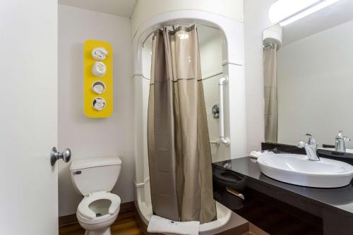 a bathroom with a shower and a toilet and a sink at Motel 6-Blythe, CA in Blythe