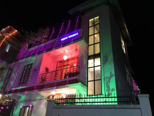 a lit up building with christmas lights on it at Ocean Terrace in Port Blair