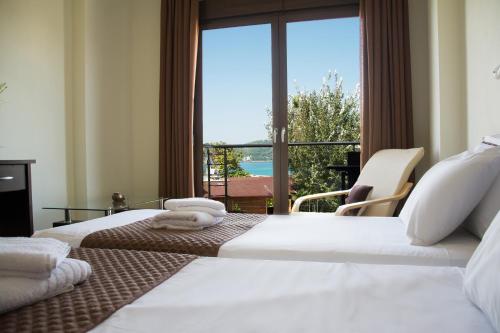 Ένα ή περισσότερα κρεβάτια σε δωμάτιο στο Belohorizonte Fine Accommodation