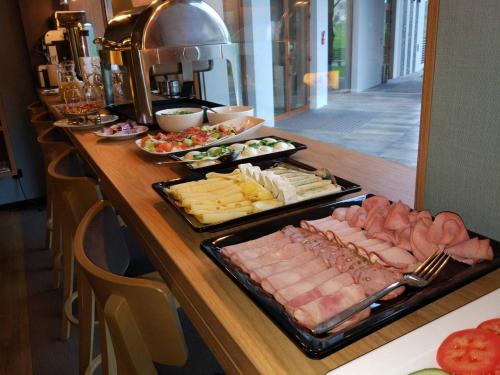a buffet with different types of food on a table at Bulwary Biznes in Mielec