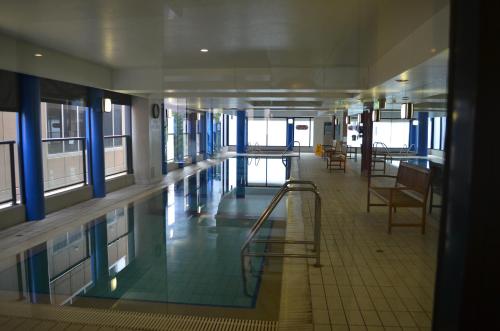 a hallway of a building with a swimming pool at APTonNorthTCE in Adelaide