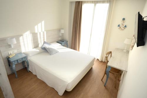 Letto o letti in una camera di Hotel L'Escala Centre