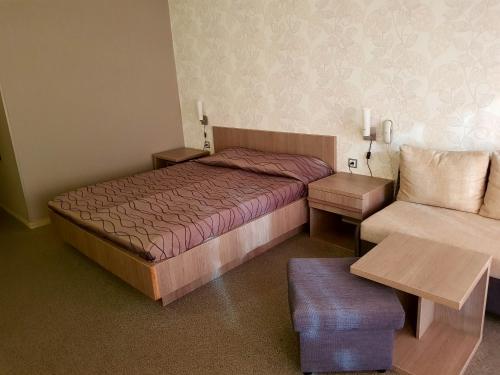 A bed or beds in a room at Spa Hotel Ata