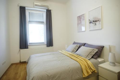Postel nebo postele na pokoji v ubytování Apartment Centar