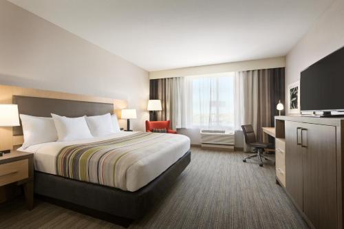 Легло или легла в стая в Country Inn & Suites by Radisson, New Braunfels, TX