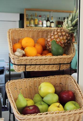 three baskets filled with apples oranges and pears at Esperides Beach Hotel Apartments in Stalos