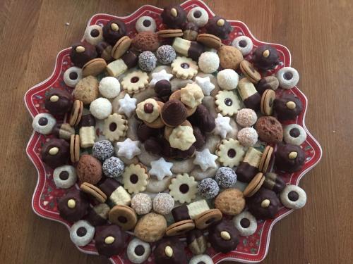 a plate full of different types of donuts on a table at Apartmány Sportrelax in Albrechtice v Jizerských horách