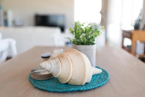 a wooden mortar and pestle sitting on a table at Shades of Blue Eco Retreat in Calca