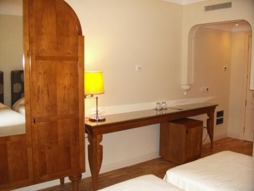Una cama o camas en una habitación de Hotel Certosa
