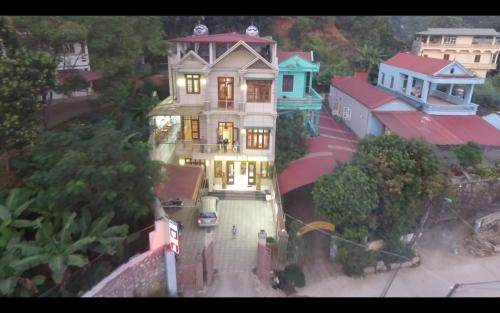a large house with lights on in a city at Duong Ha Hotel in Cao Bằng