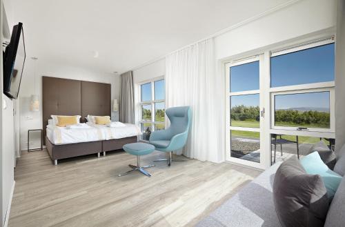 Postel nebo postele na pokoji v ubytování Hotel Hamar