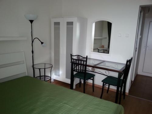 Postel nebo postele na pokoji v ubytování Aranyhíd Ilona Apartman