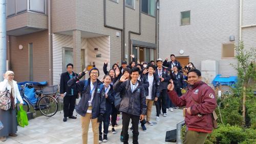 a group of people standing in front of a building at Tokyo Guest House 2020 in Tokyo