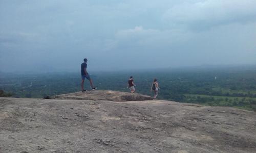 a group of people standing on top of a rock at Elephant safari Lodge sigiriya junction in Habarana