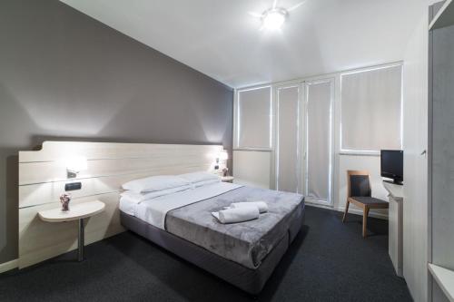 Postel nebo postele na pokoji v ubytování Hotel Giallo